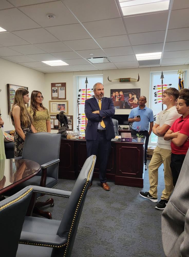 Students visiting a state legislator's office during a civics field trip