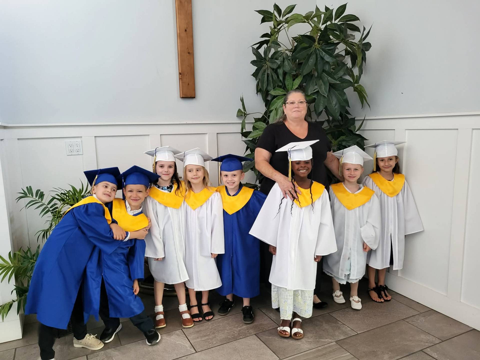 Victory Baptist Academy kindergarten graduates in caps and gowns
